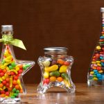 Cans and glass bottles with candies